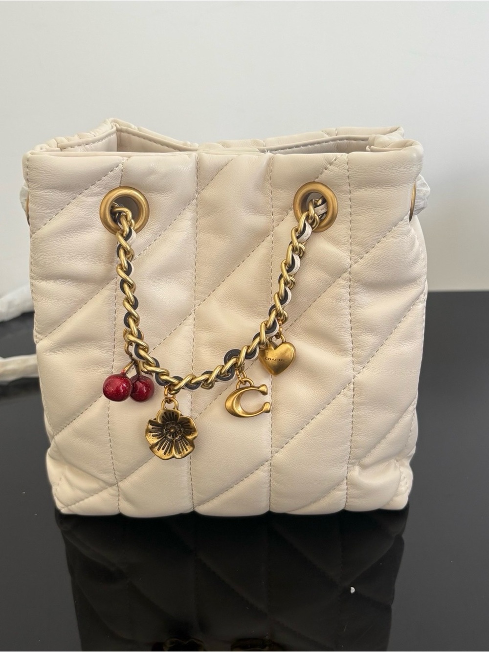 Coach Cream Quilted Mini Bucket Bag with Charm Chain